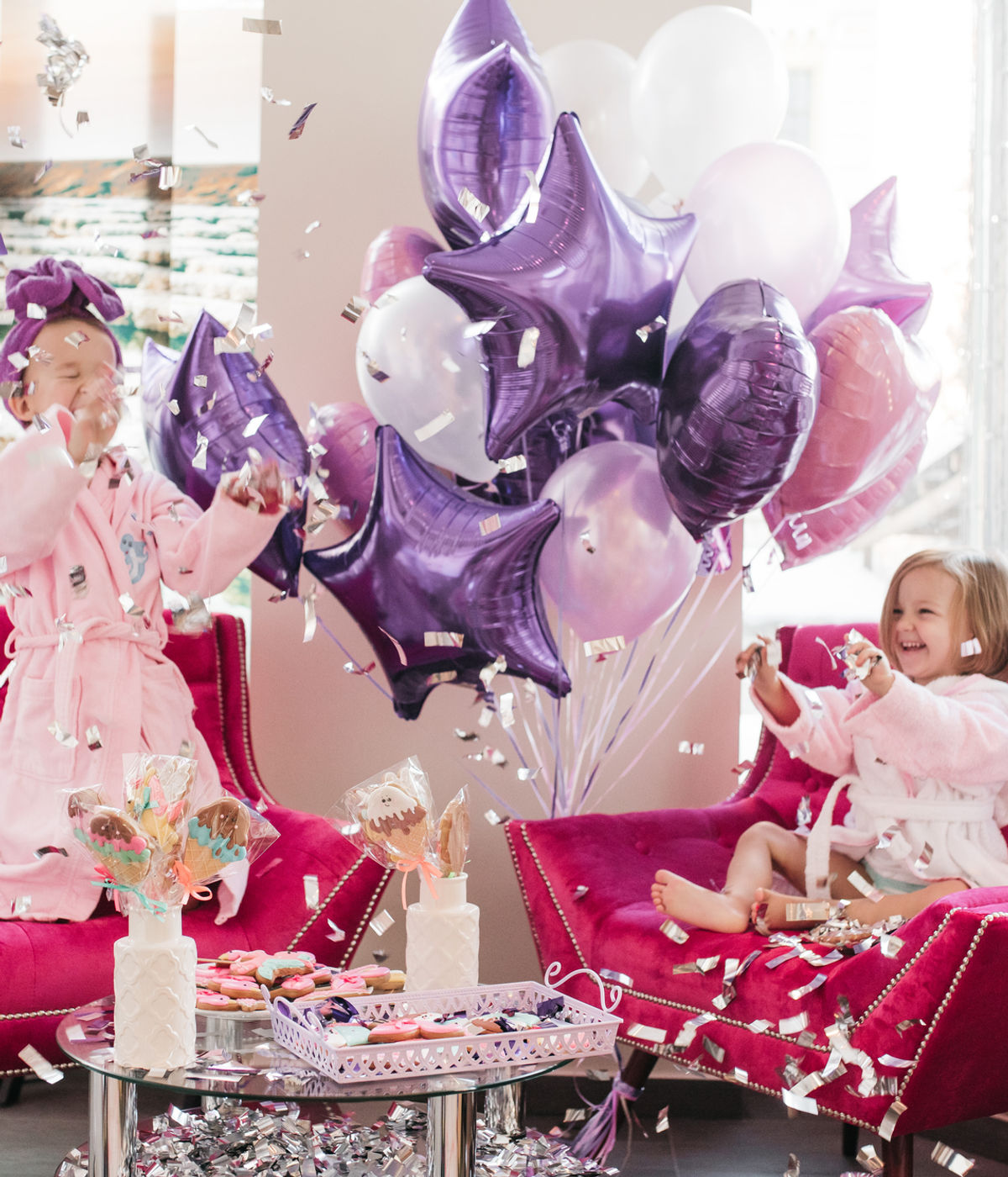 Girls celebrating with balloons and confetti